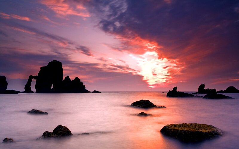 Sunset over sea rocks