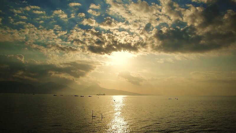 Sunset over Sea with Boats