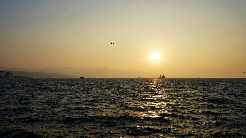 Sunset over Sea — Yellow, Serene, Photograph, Ships