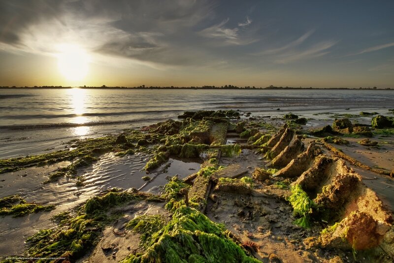 Sunset over shipwreck debris