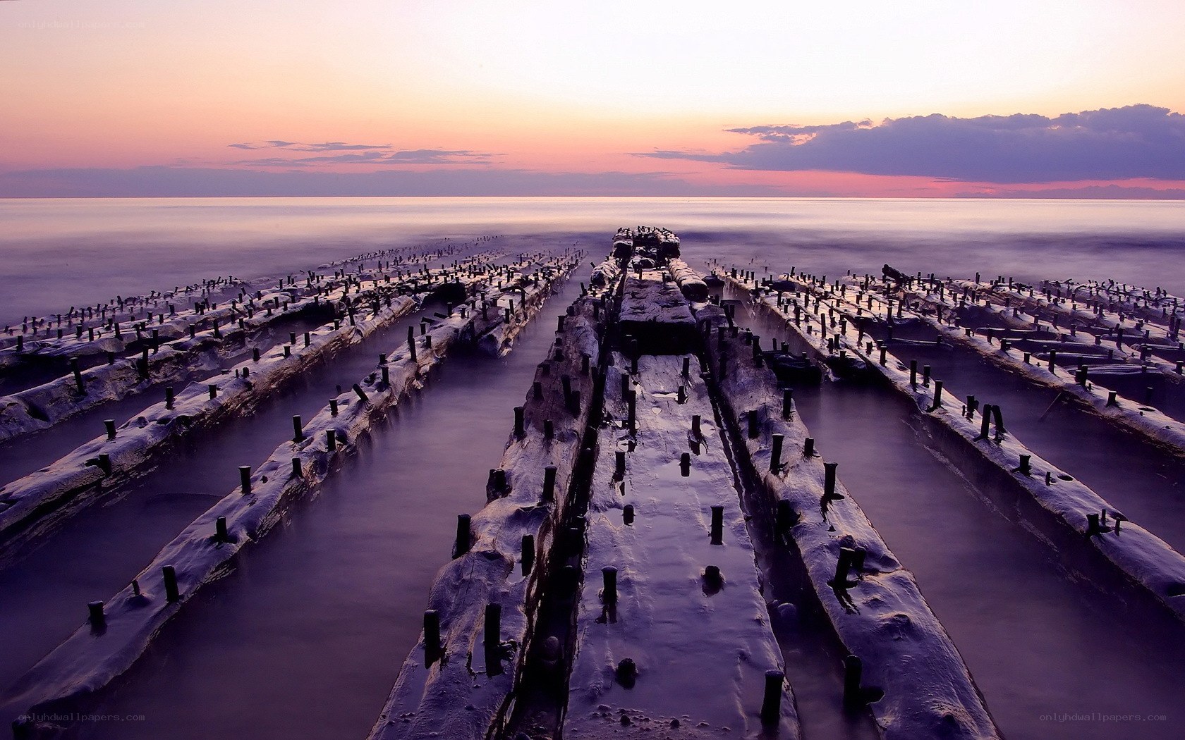 Sunset over shipwreck ruins