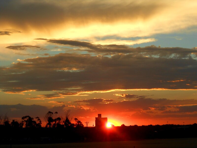 Sunset over Silhouetted Buildings — Orange, Dramatic