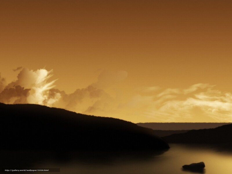 Sunset over silhouetted hills