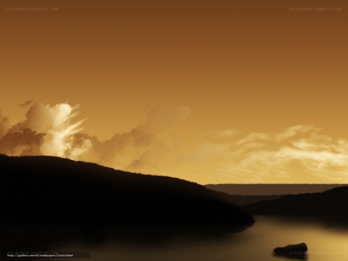 Sunset over silhouetted hills