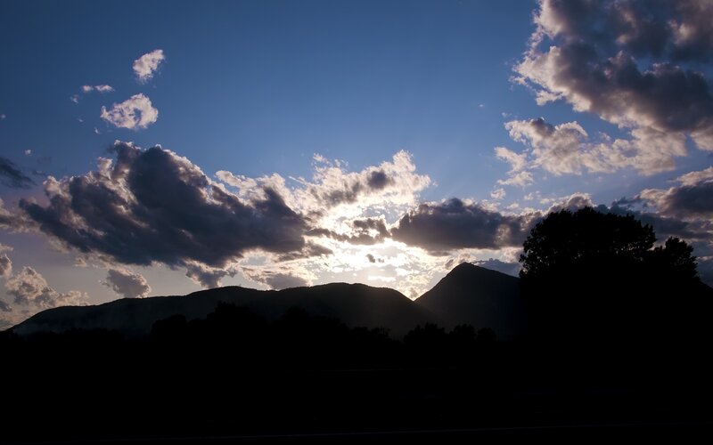 Sunset over silhouetted mountains