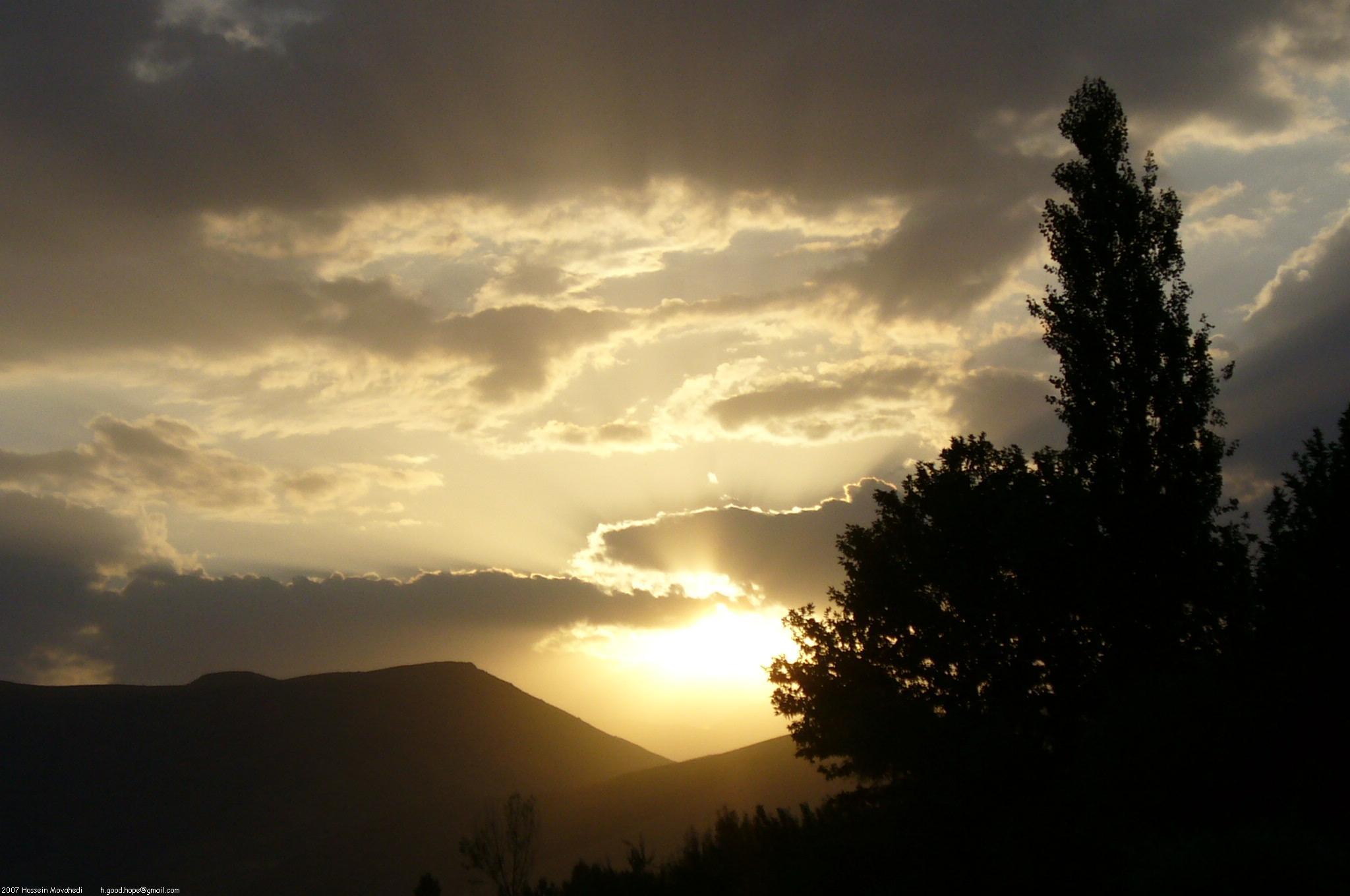 Sunset over silhouetted mountains