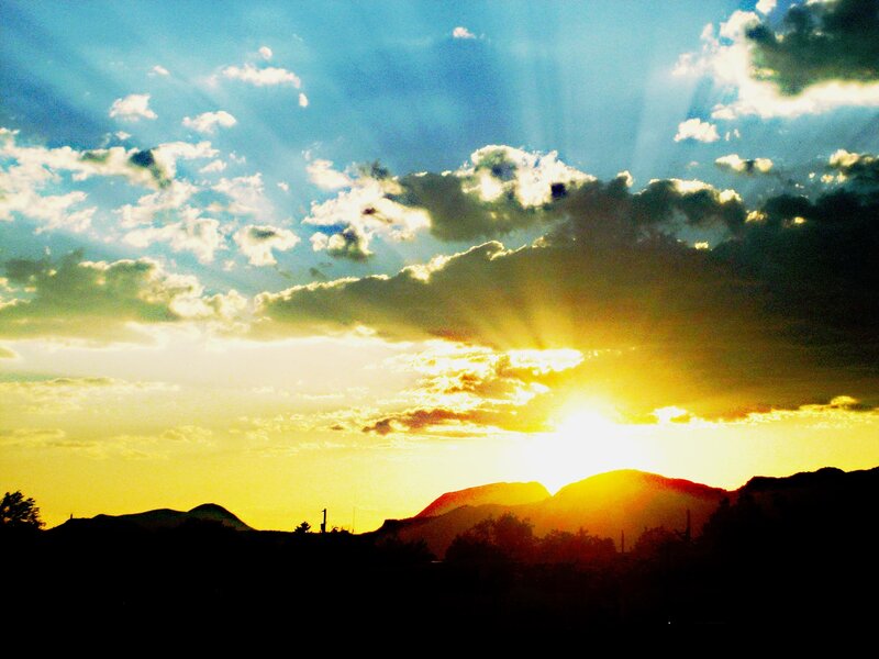 Sunset over silhouetted mountains