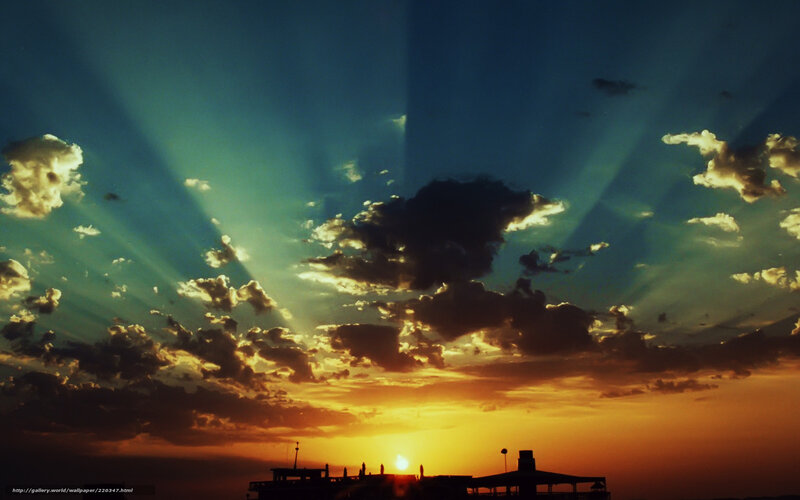 Sunset over Silhouetted Structures — Orange