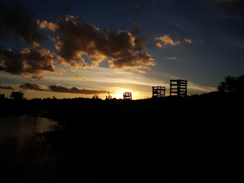 sunset over silhouetted structures