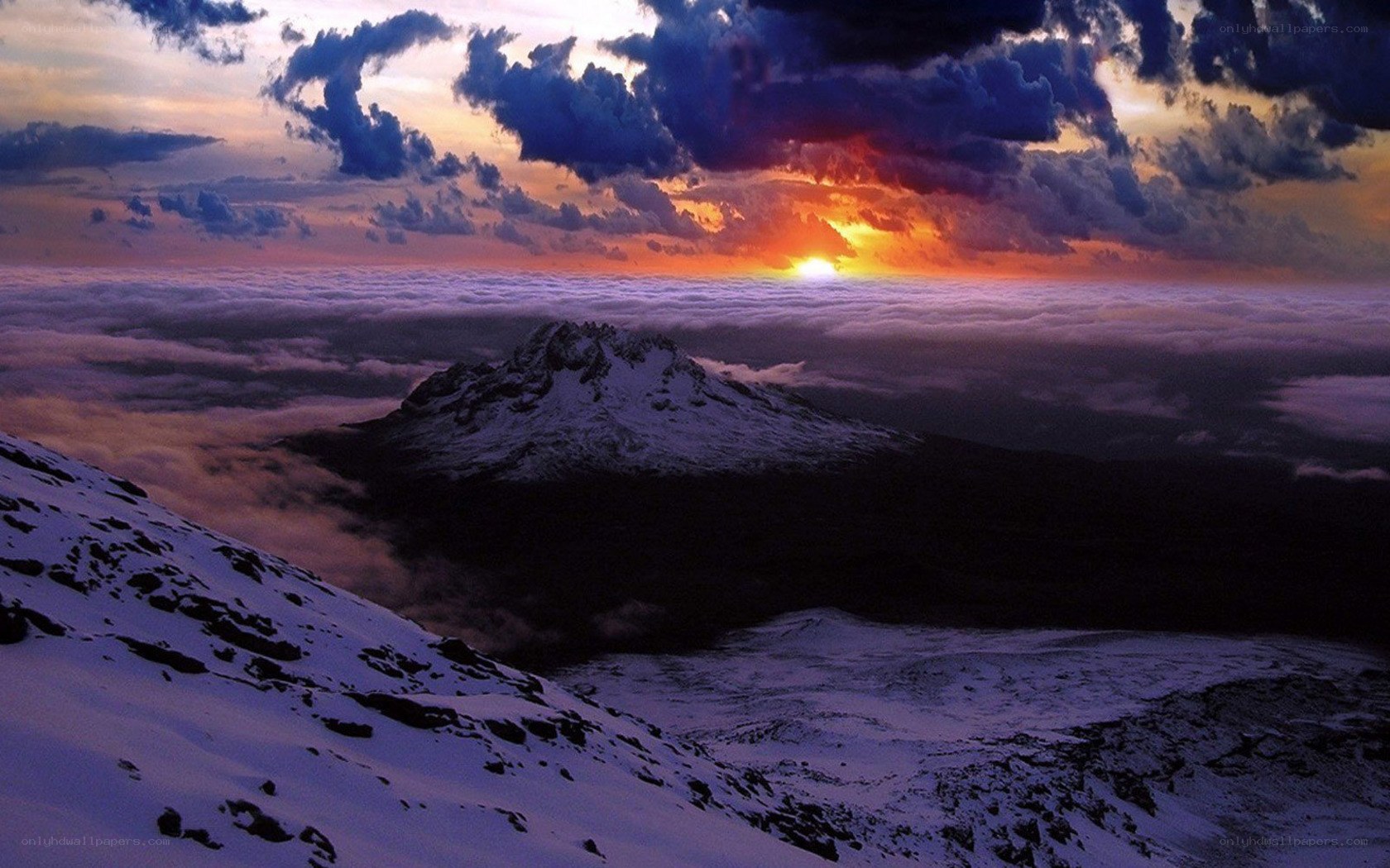 Sunset over snow-capped mountain