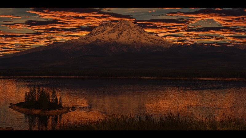 Sunset over snow-capped mountain lake