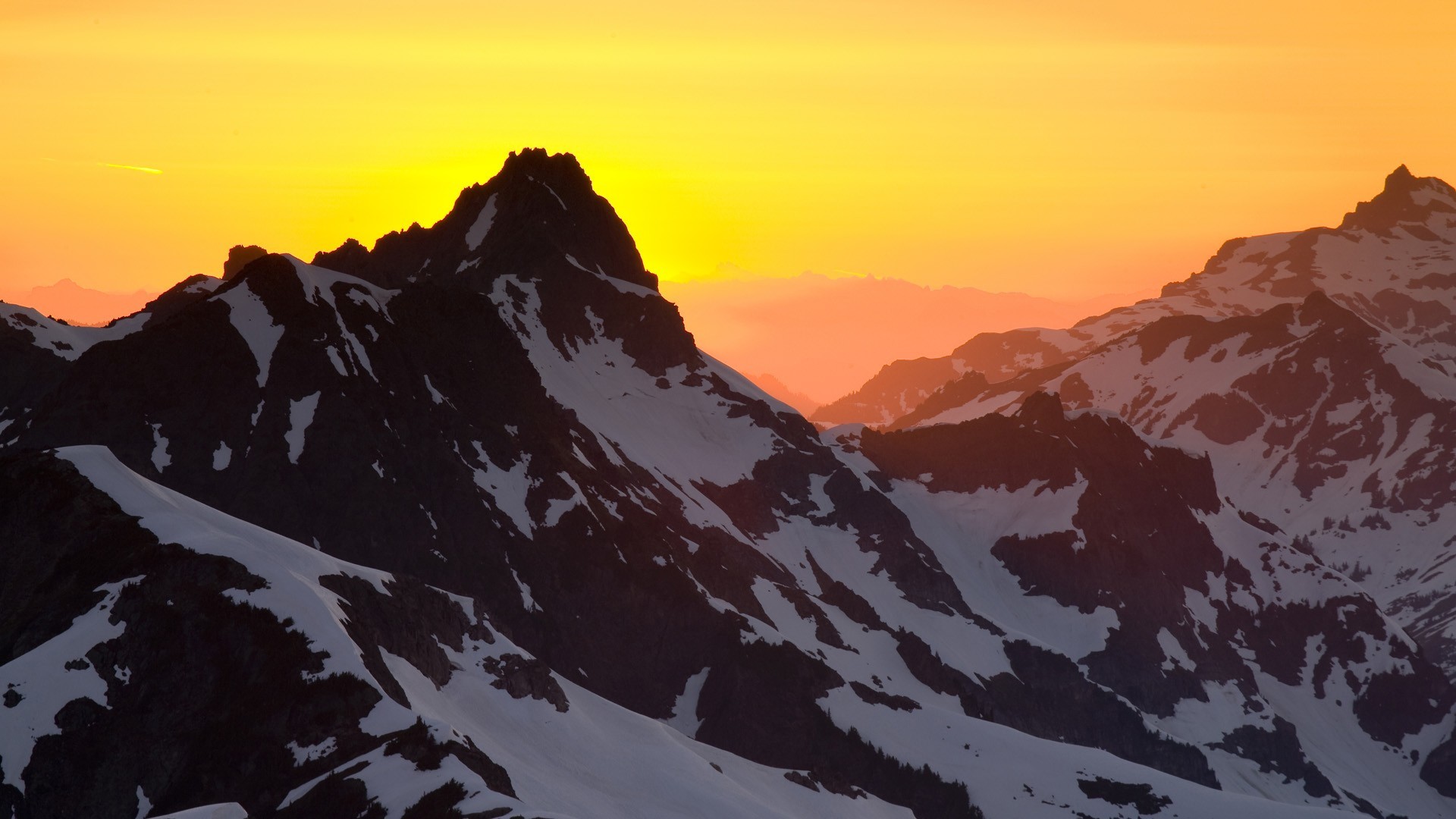 Sunset over snow-capped mountains