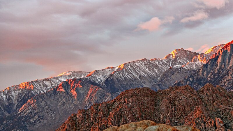 Sunset over snow-capped mountains