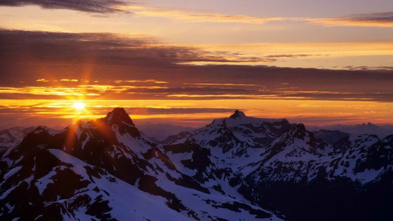 Sunset over snow-capped mountains