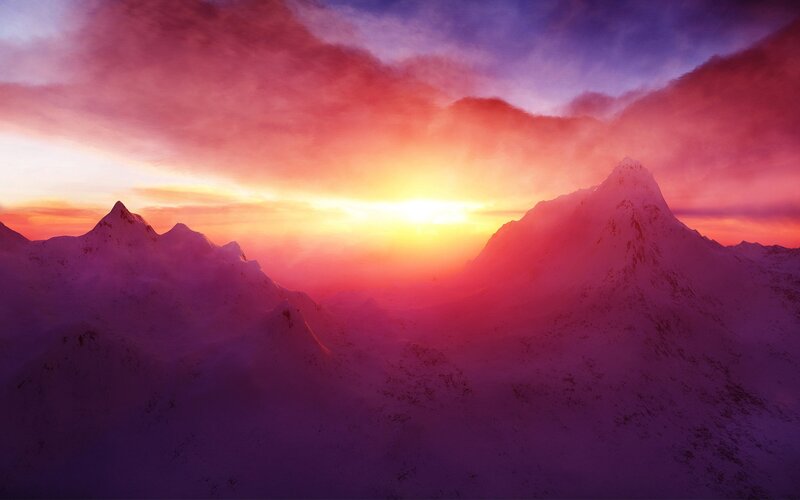 sunset over snow-capped mountains