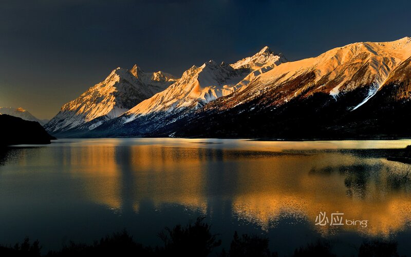 Sunset over snow-capped mountains