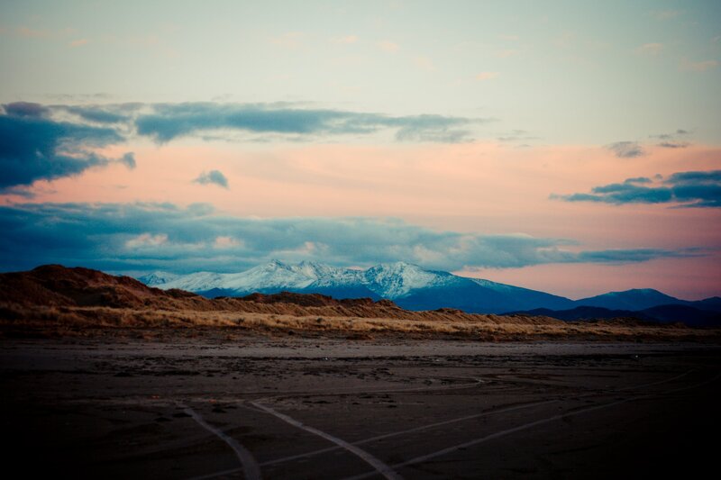 sunset over snow-capped mountains