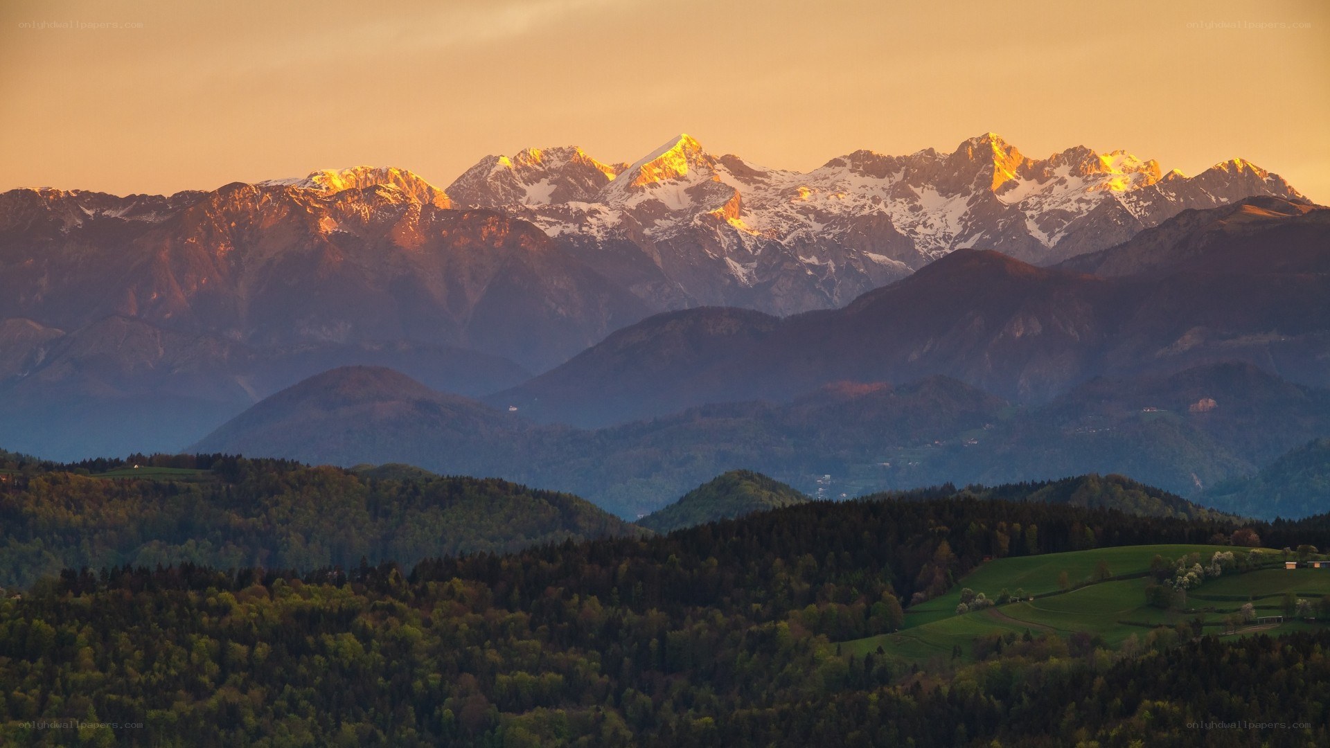 Sunset over snow-capped mountains