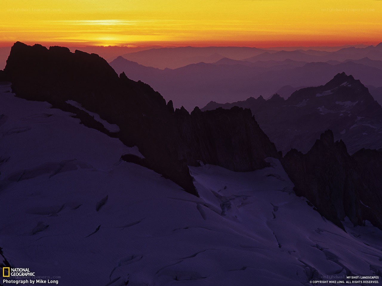 Sunset over snow-capped mountains