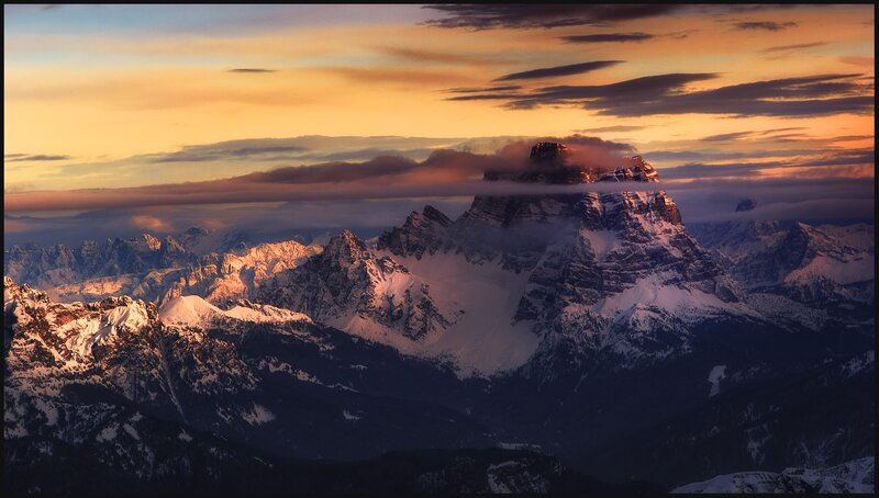 Sunset over snow-capped mountains
