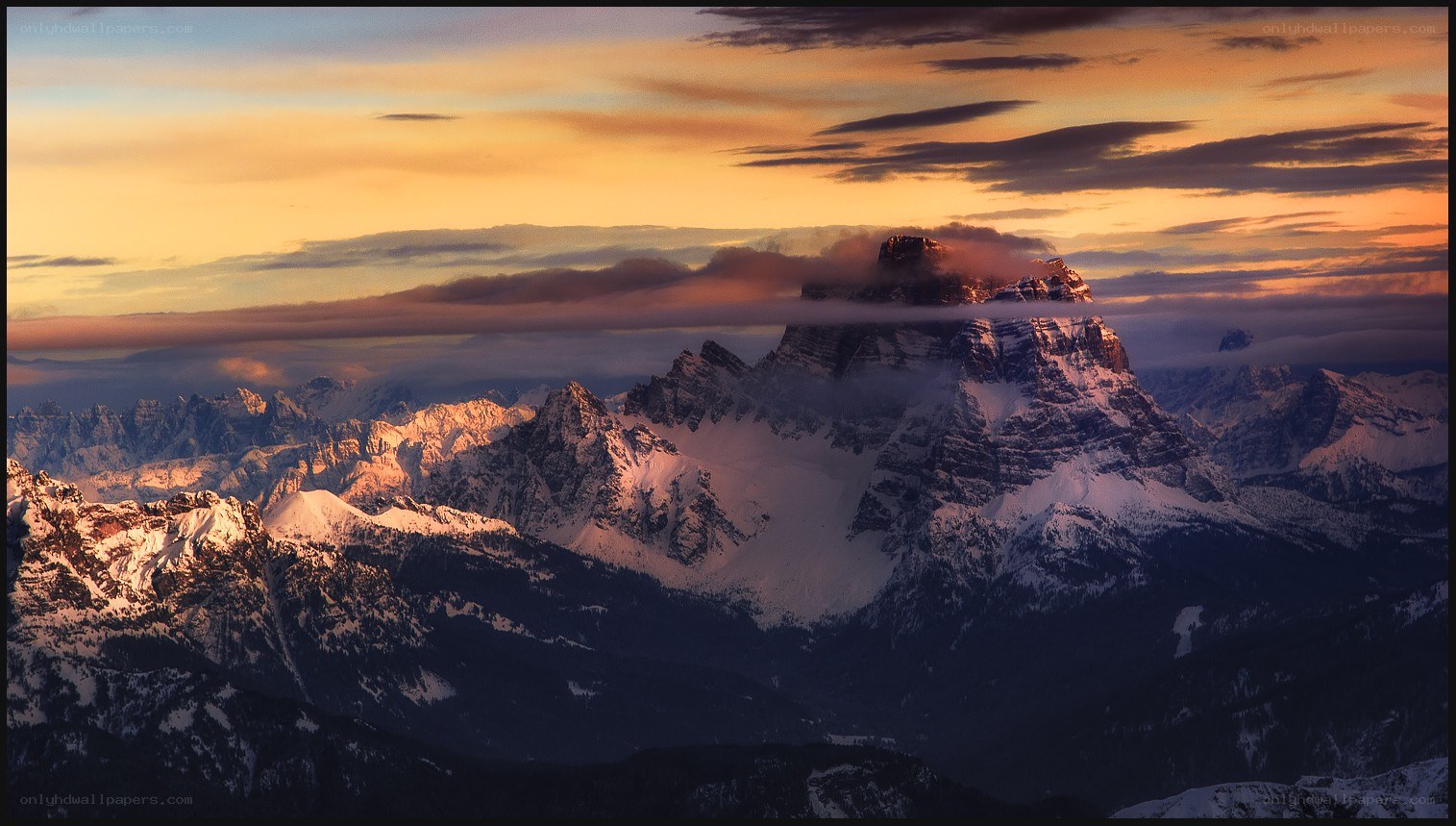 Sunset over snow-capped mountains