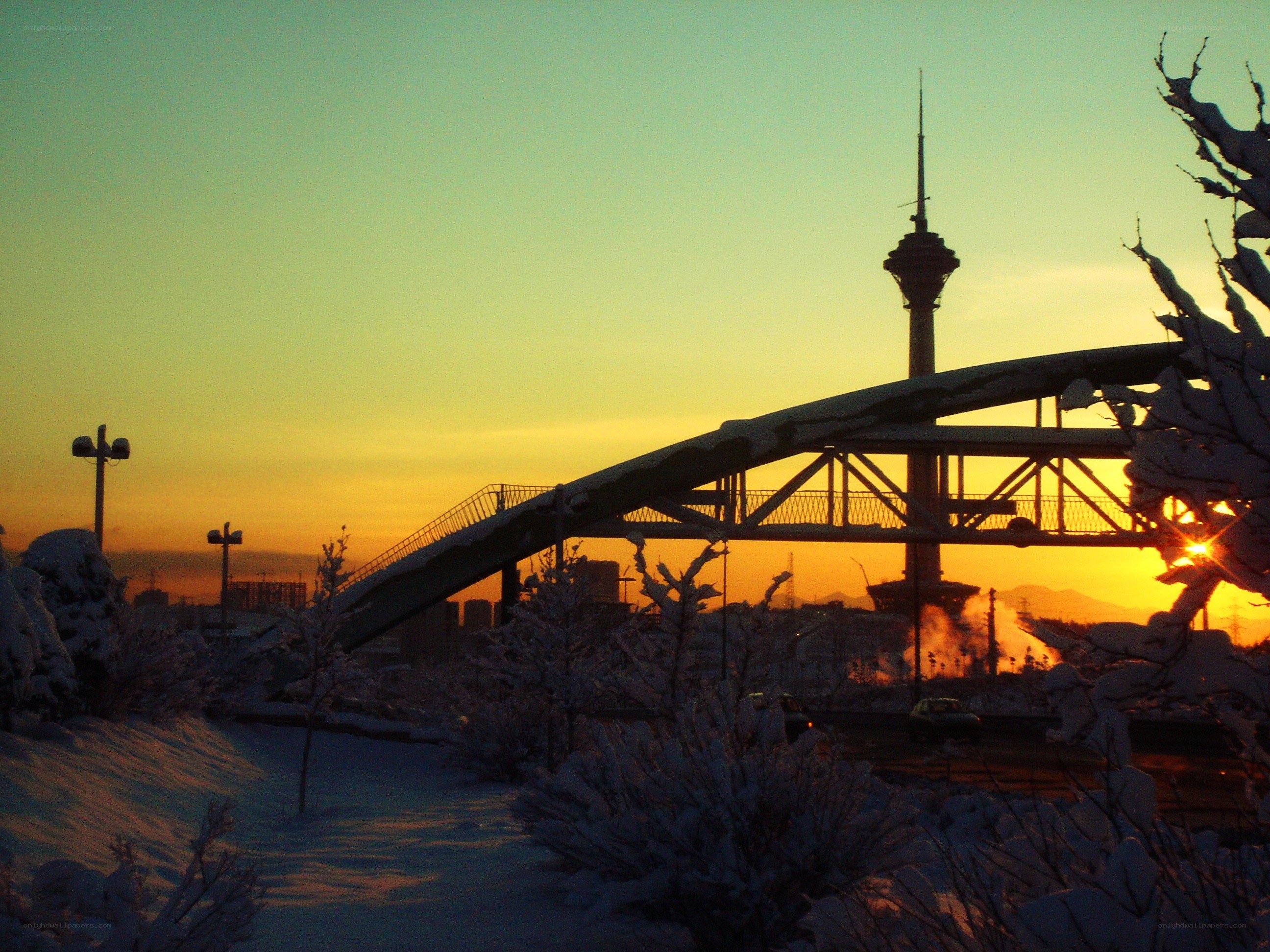 Sunset over snow-covered city