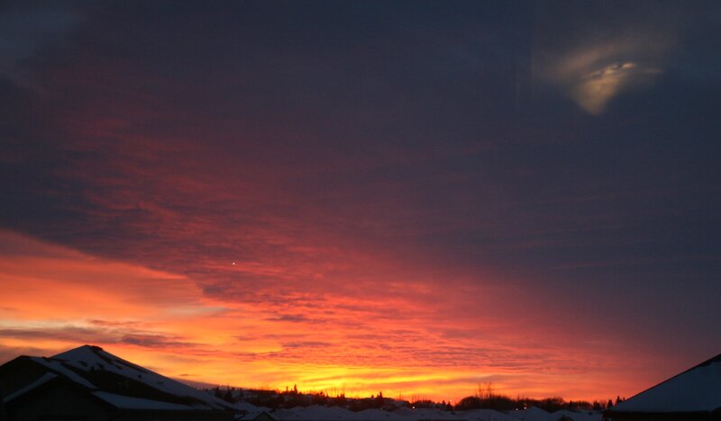 Sunset over Snow-covered Houses