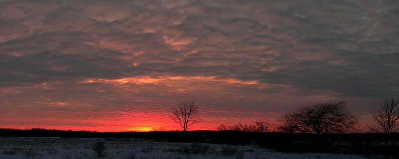 sunset over snowy field
