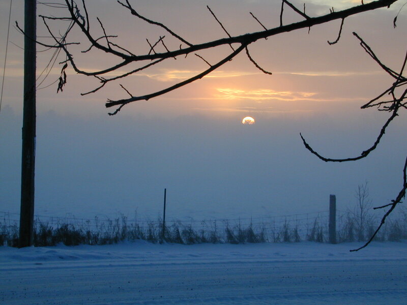 Sunset over snowy field