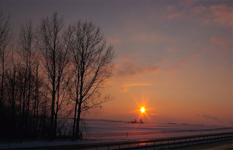 Sunset over snowy field