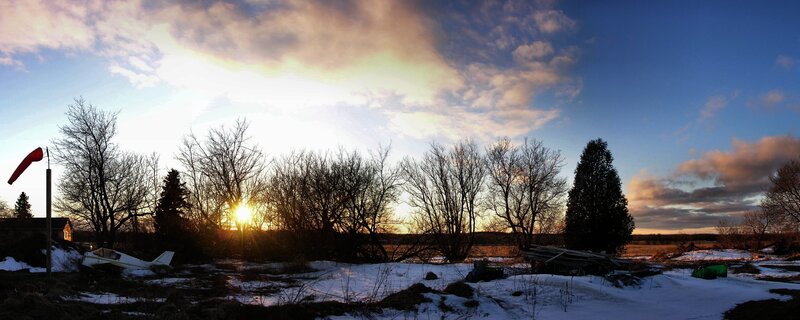 sunset over snowy field