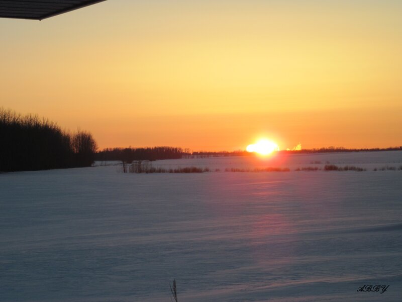 Sunset over Snowy Field — Orange, Serene, Winter, Photograph
