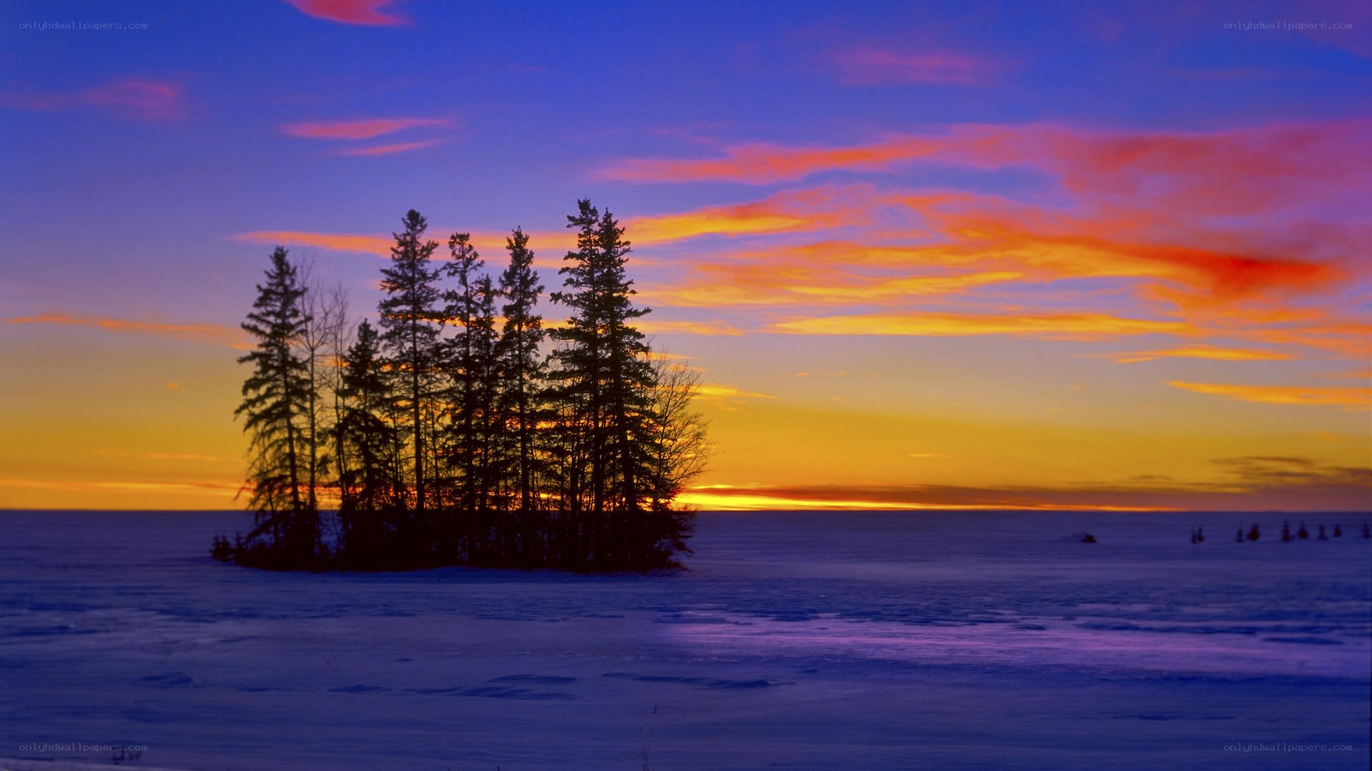 sunset over snowy island