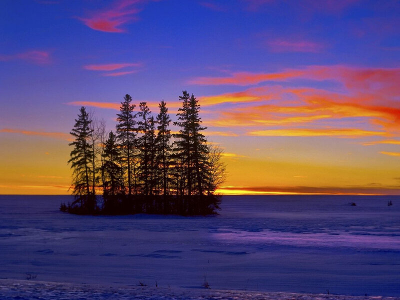 Sunset over snowy island