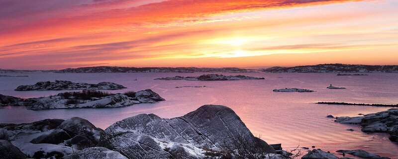 Sunset over snowy islands