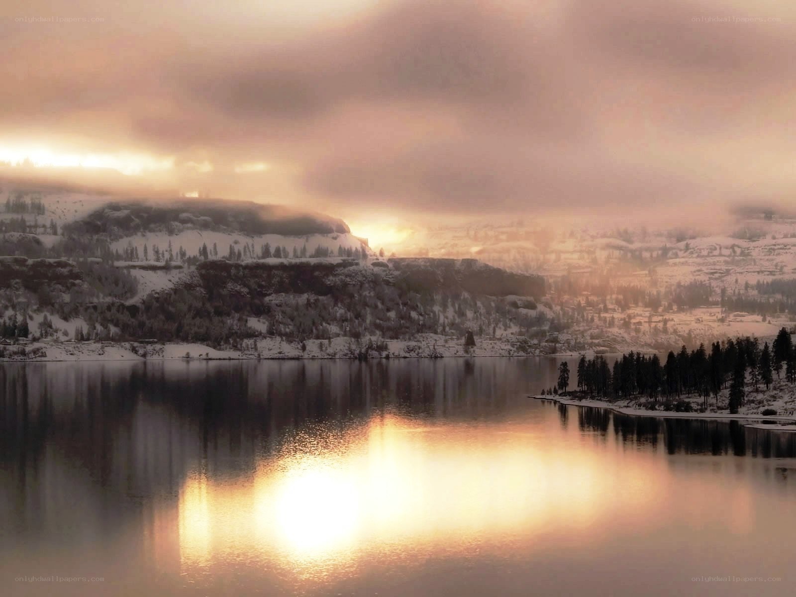 Sunset over snowy lake
