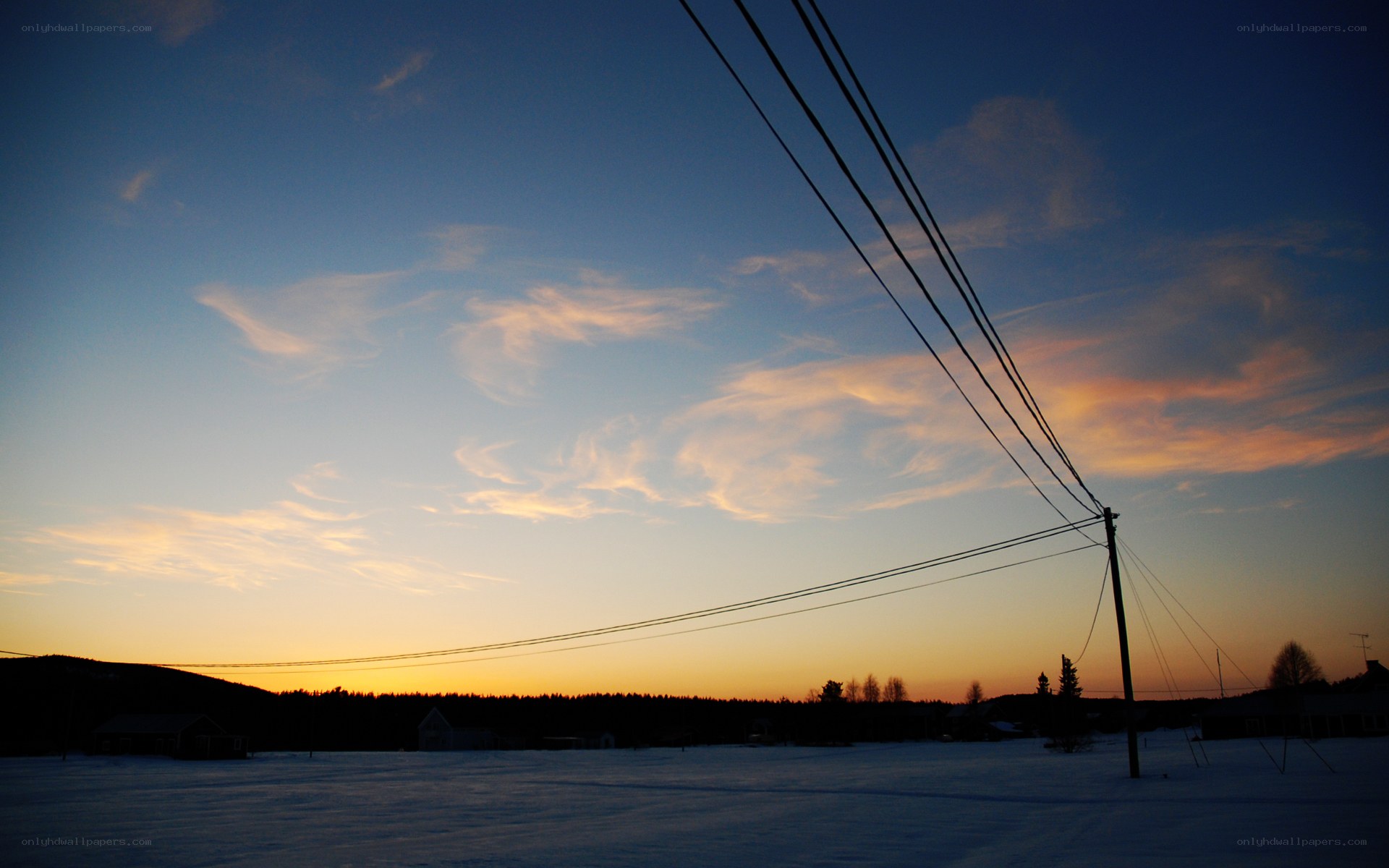 sunset over snowy landscape