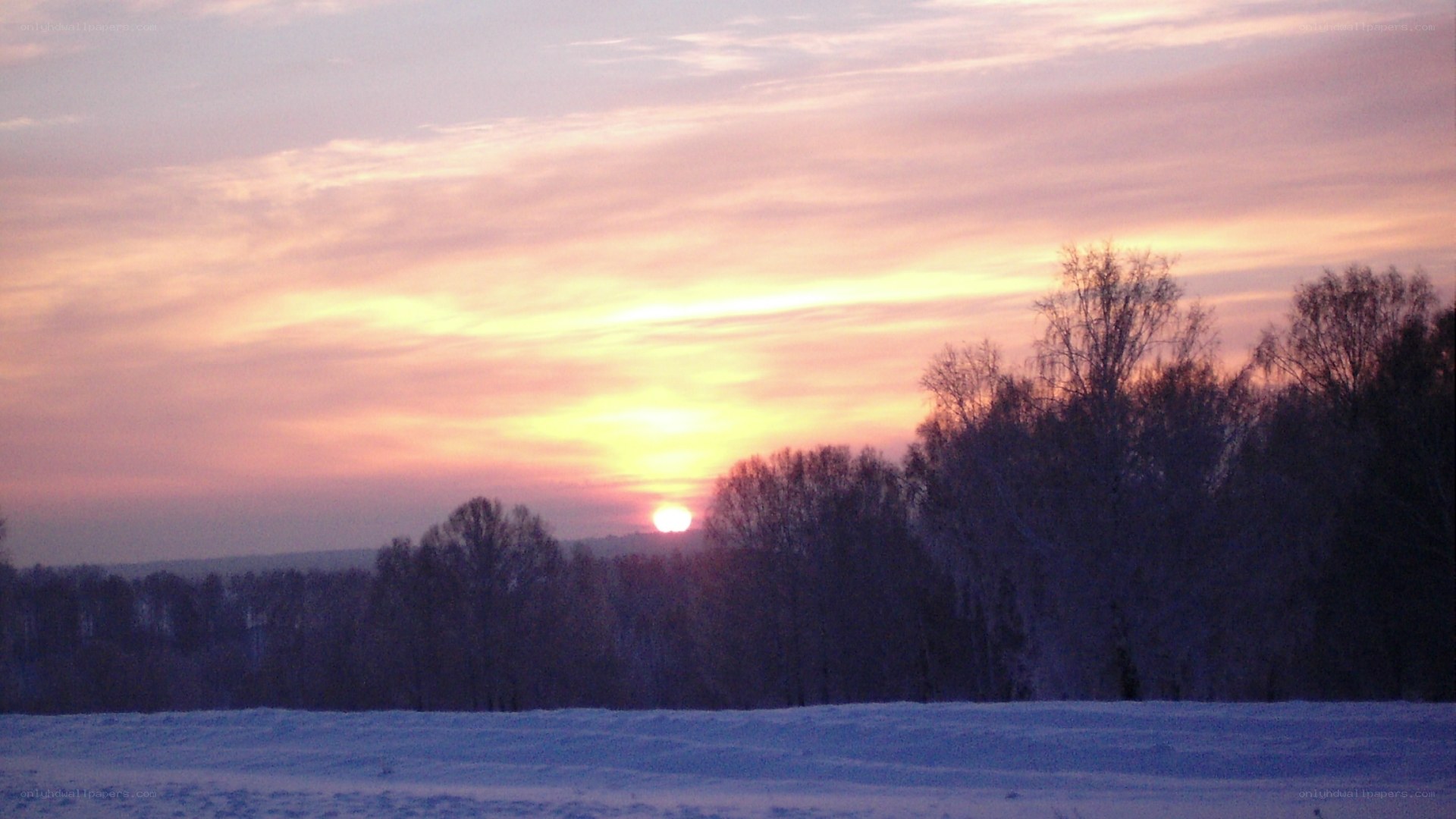 Sunset over snowy landscape