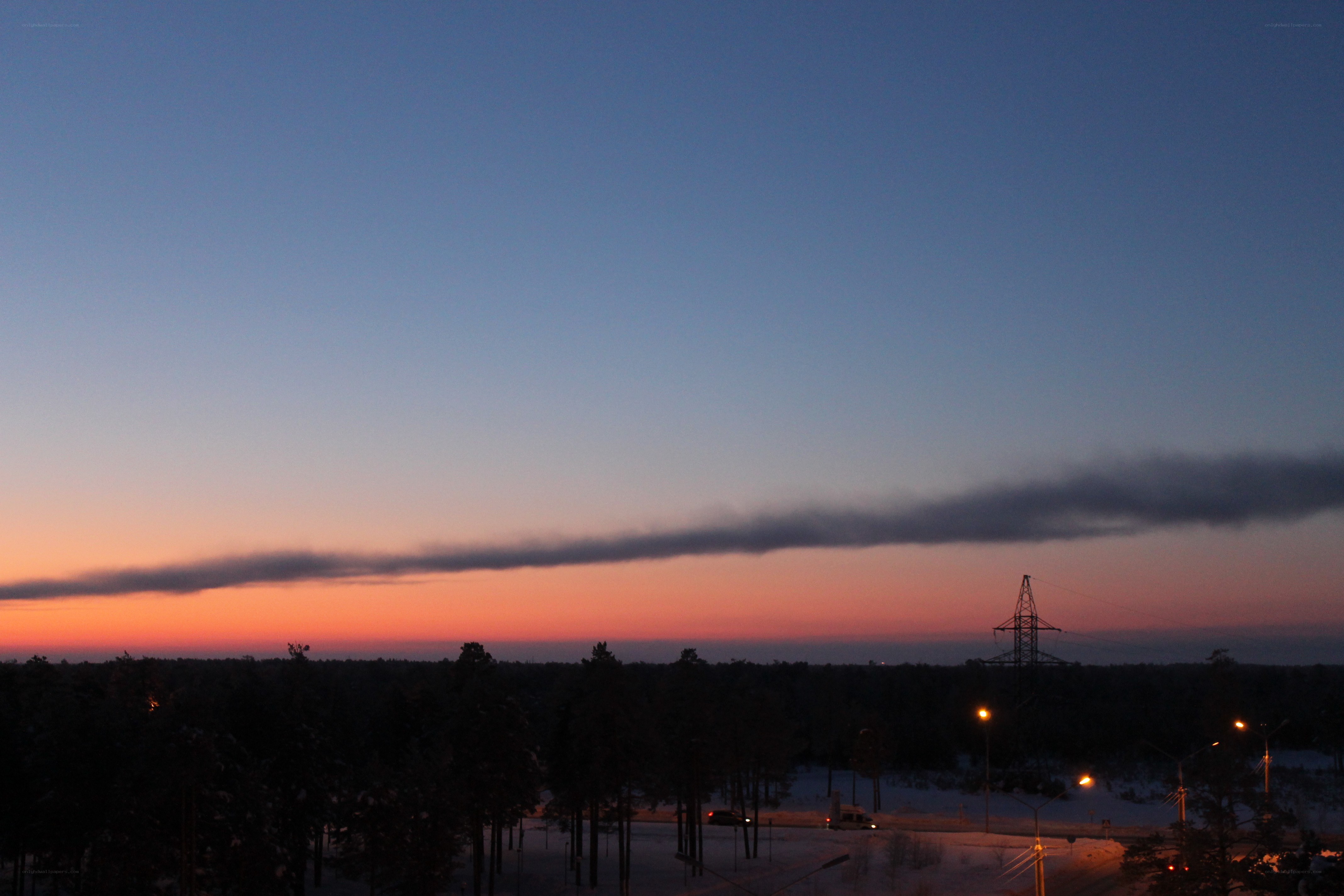 sunset over snowy landscape