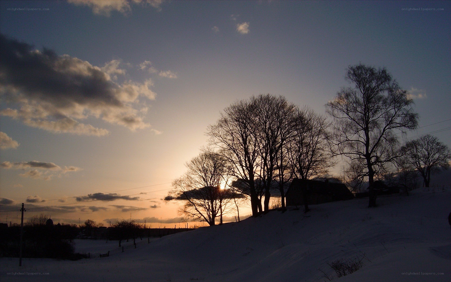sunset over snowy landscape