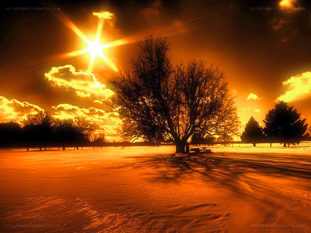 sunset over snowy landscape