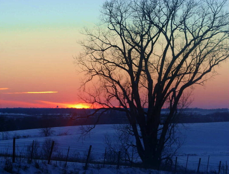 sunset over snowy landscape
