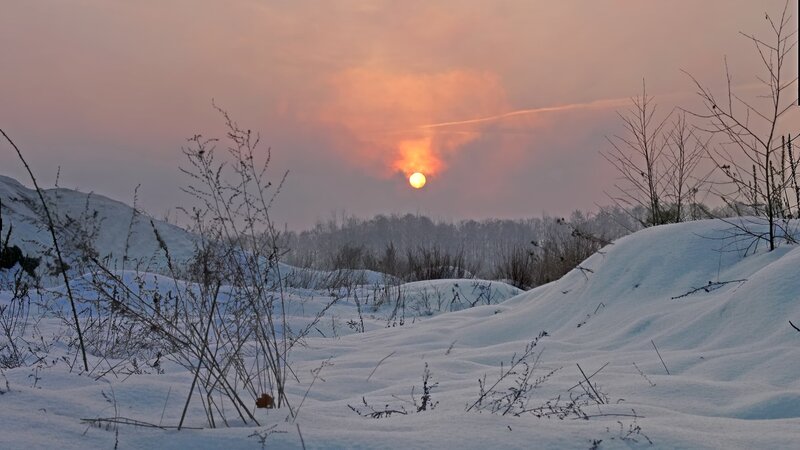 Sunset over Snowy Landscape — Orange, Serene