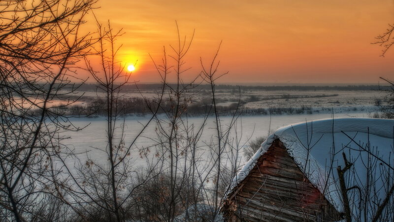 Sunset over Snowy Landscape — Orange