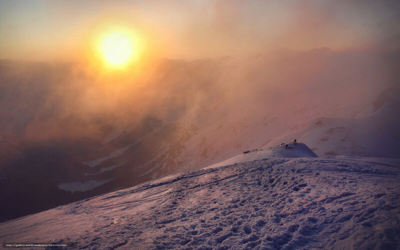 Sunset over snowy mountain peak