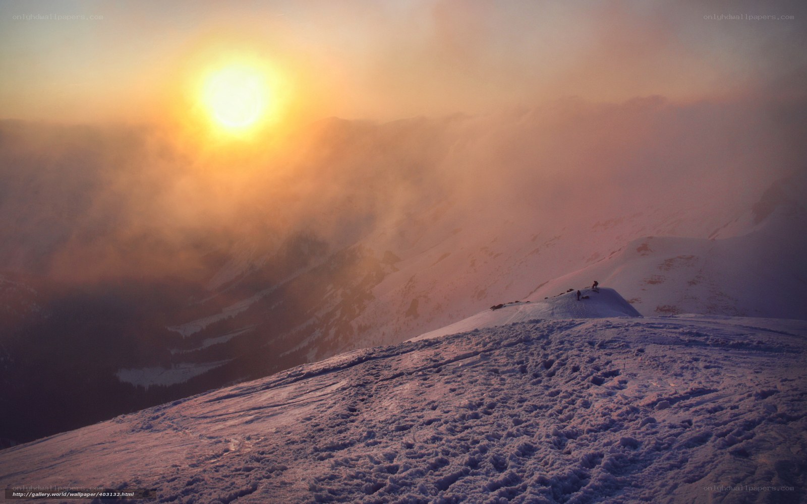 Sunset over snowy mountain peak