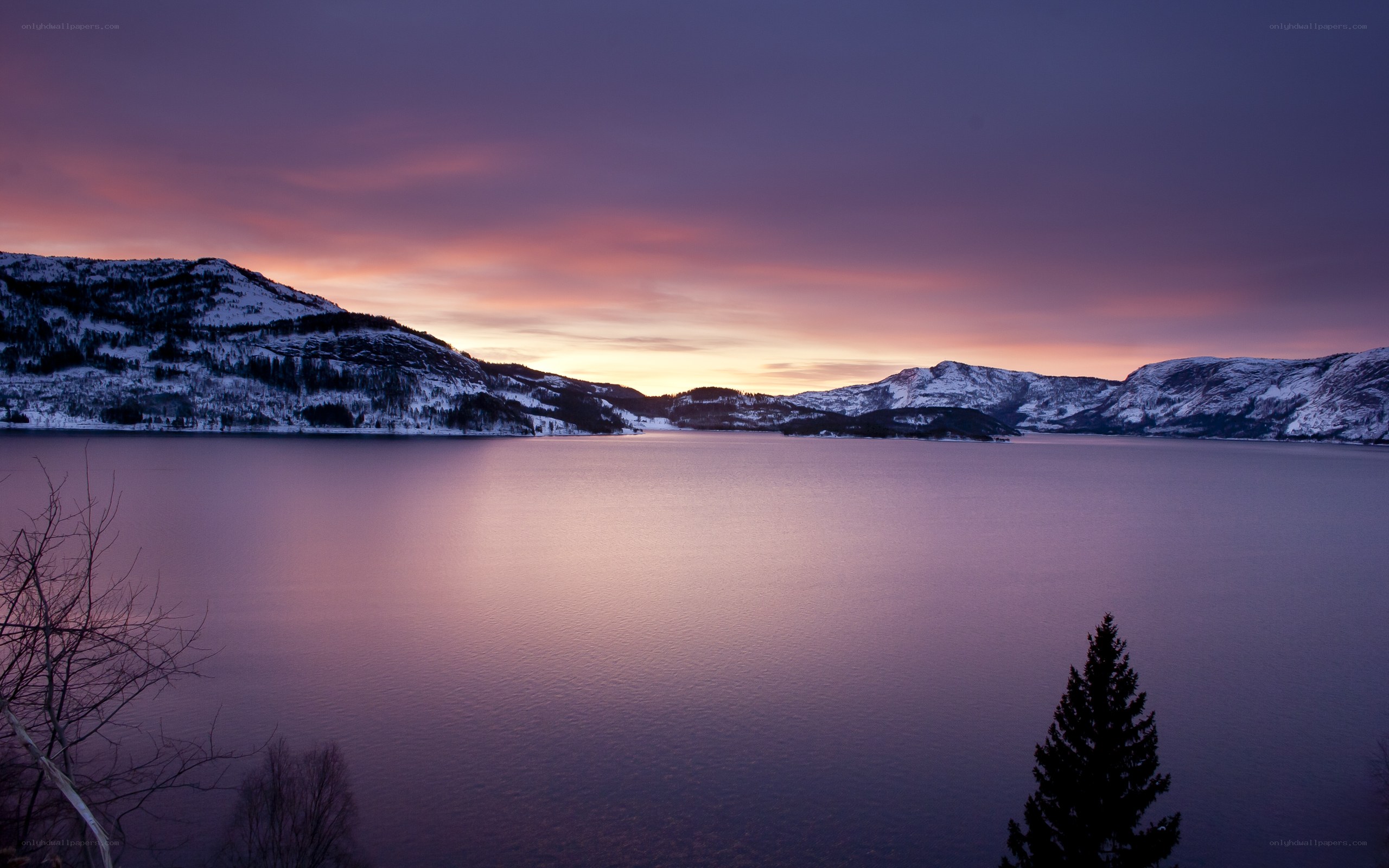 sunset over snowy mountains