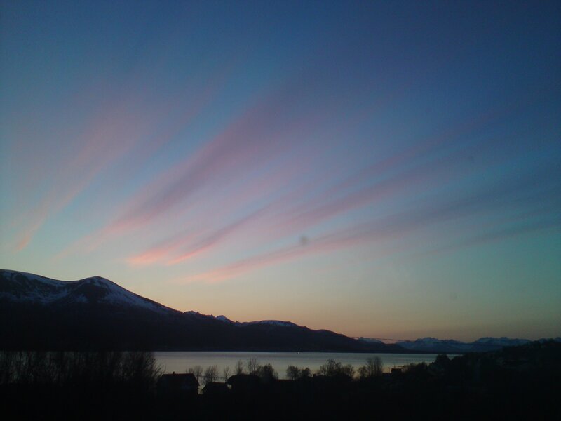 sunset over snowy mountains