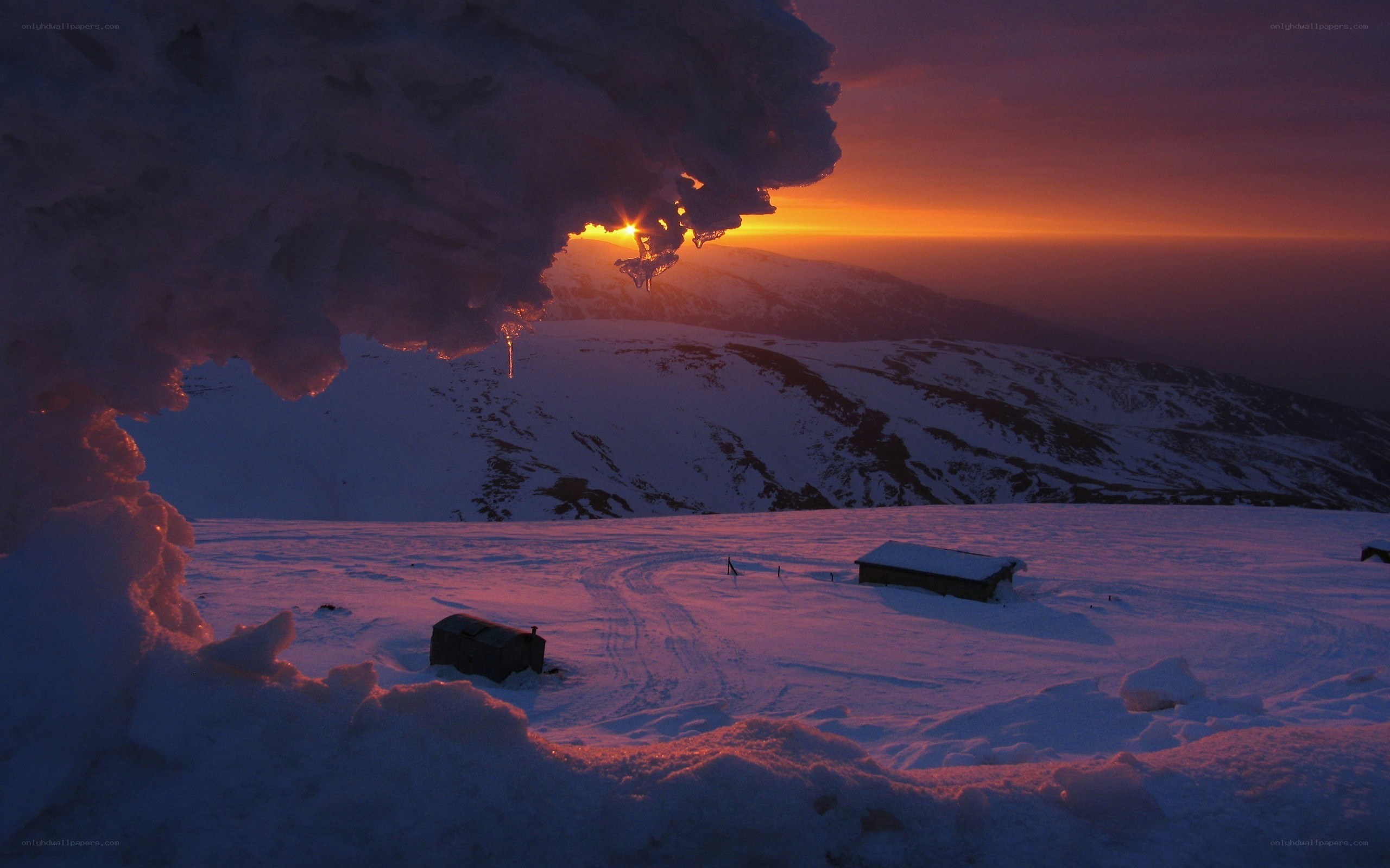 Sunset over snowy mountains