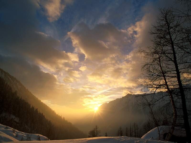 Sunset over snowy mountains